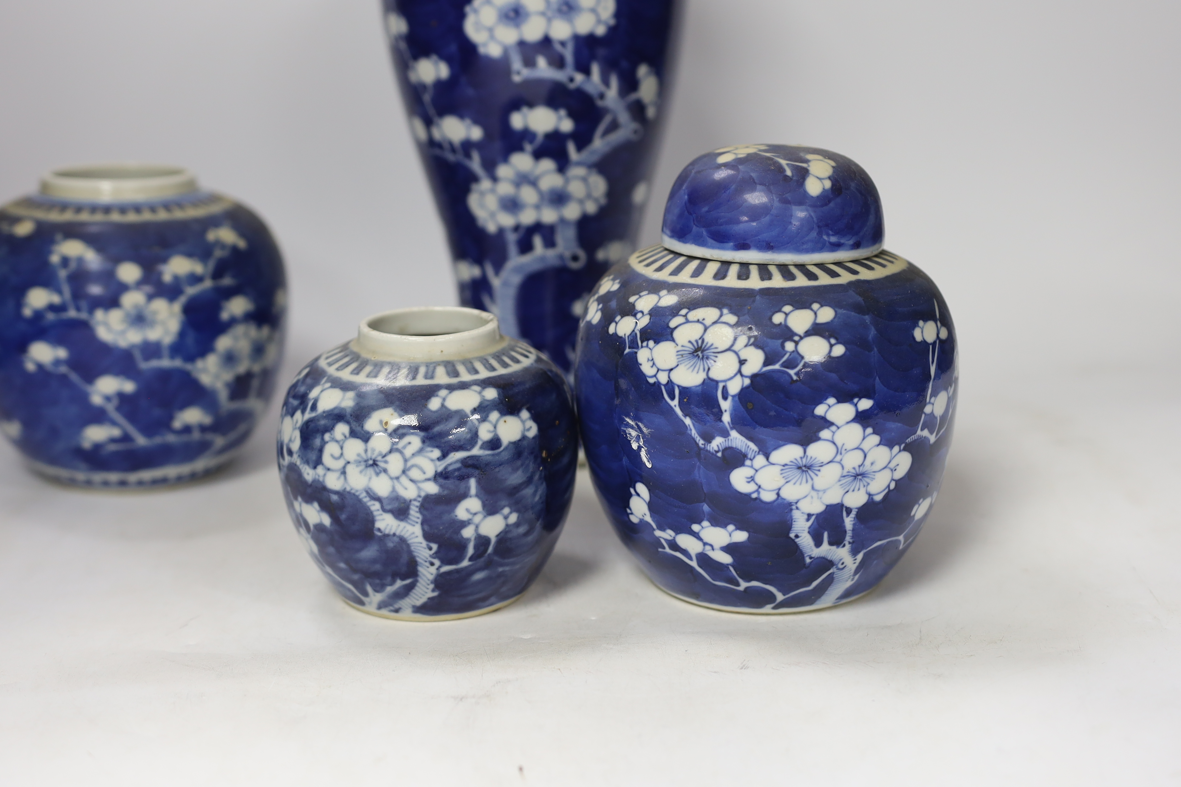 Three early 20th century Chinese blue and white jars (one with cover) and a similar vase and cover (a.f.), tallest 37cm